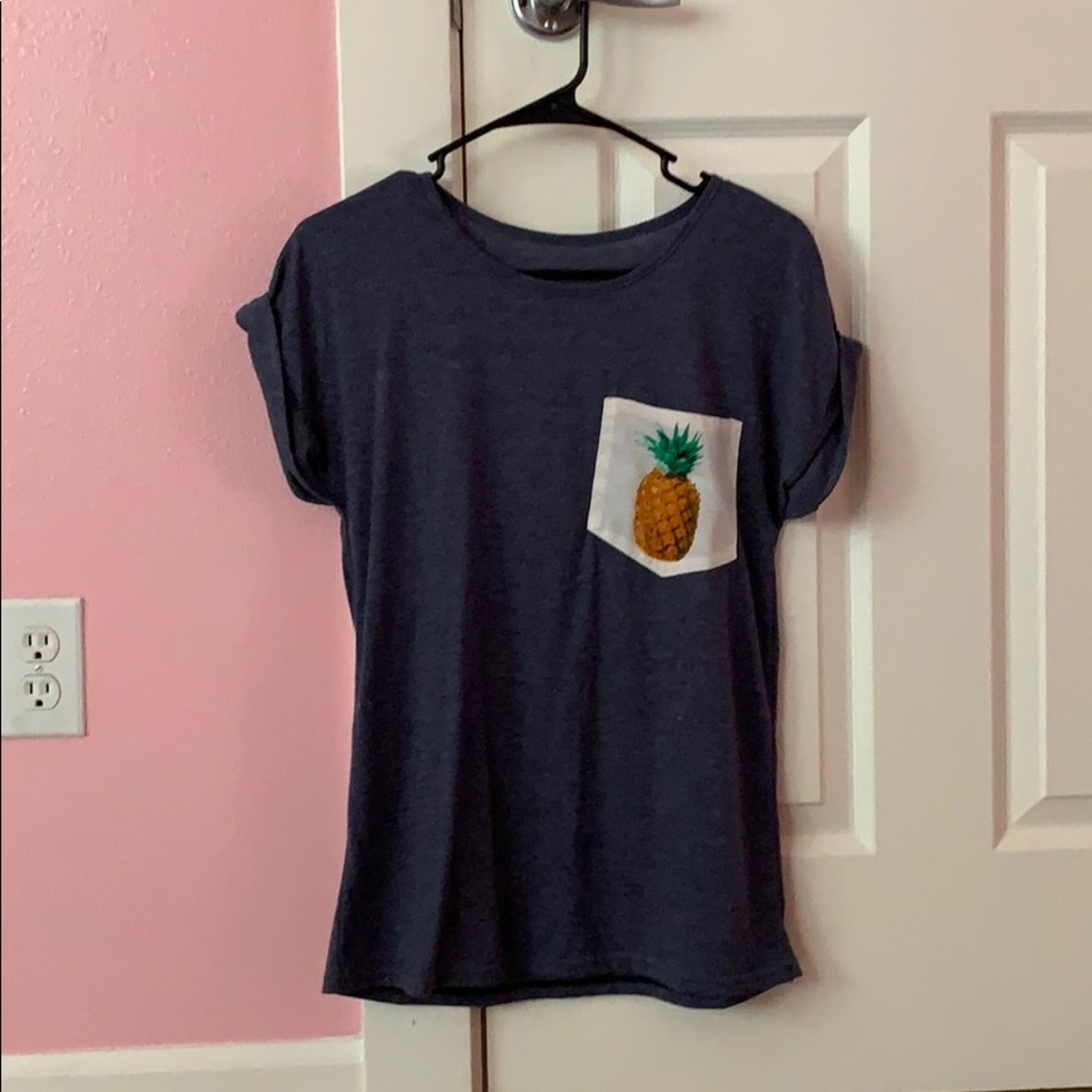 blue t-shirt with white pineapple pocket